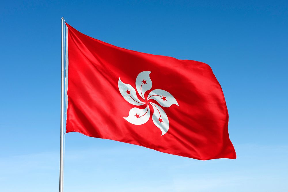 Waving Hong Kong flag, national symbol, blue sky