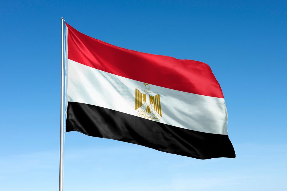 Waving Egypt flag, national symbol, blue sky