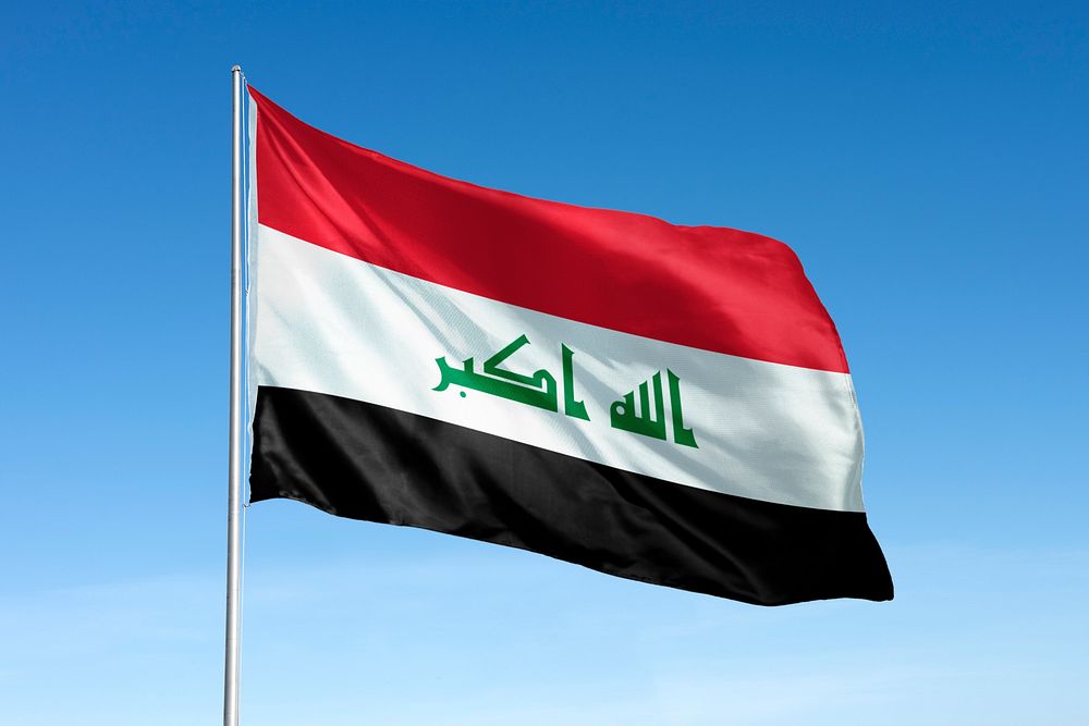 Waving Iraq flag, national symbol, blue sky
