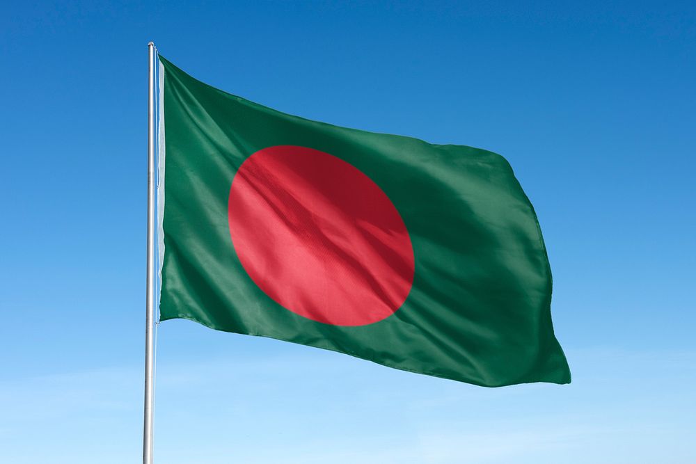 Waving Bangladesh flag, national symbol, blue sky
