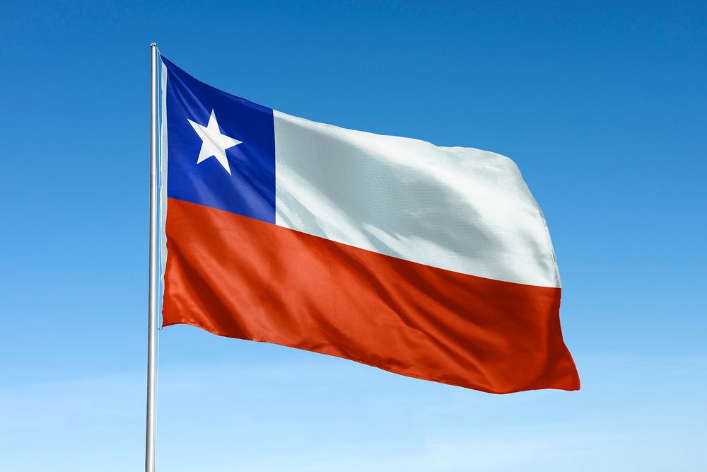 Waving Chile flag, national symbol, blue sky
