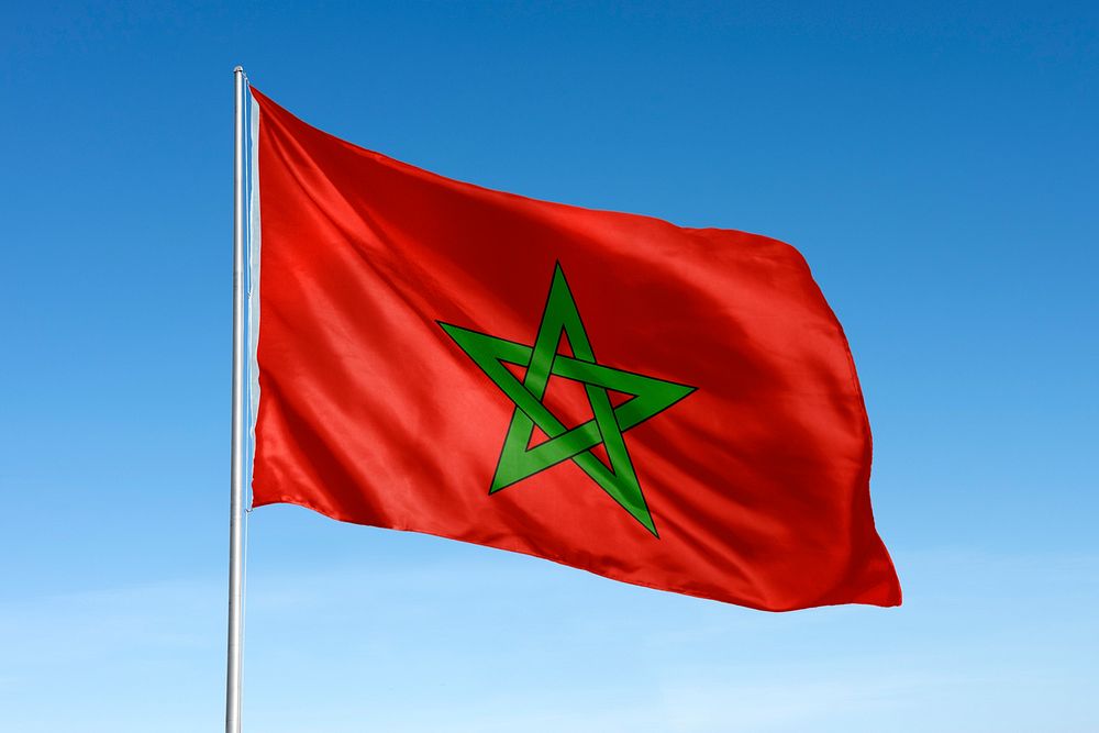 Waving Morocco flag, national symbol, blue sky