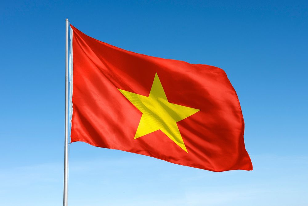 Waving Vietnam flag, national symbol, blue sky