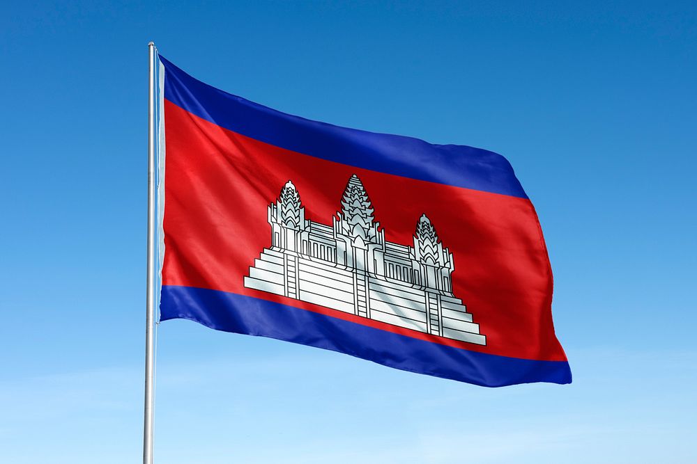 Waving Cambodia flag, national symbol, blue sky