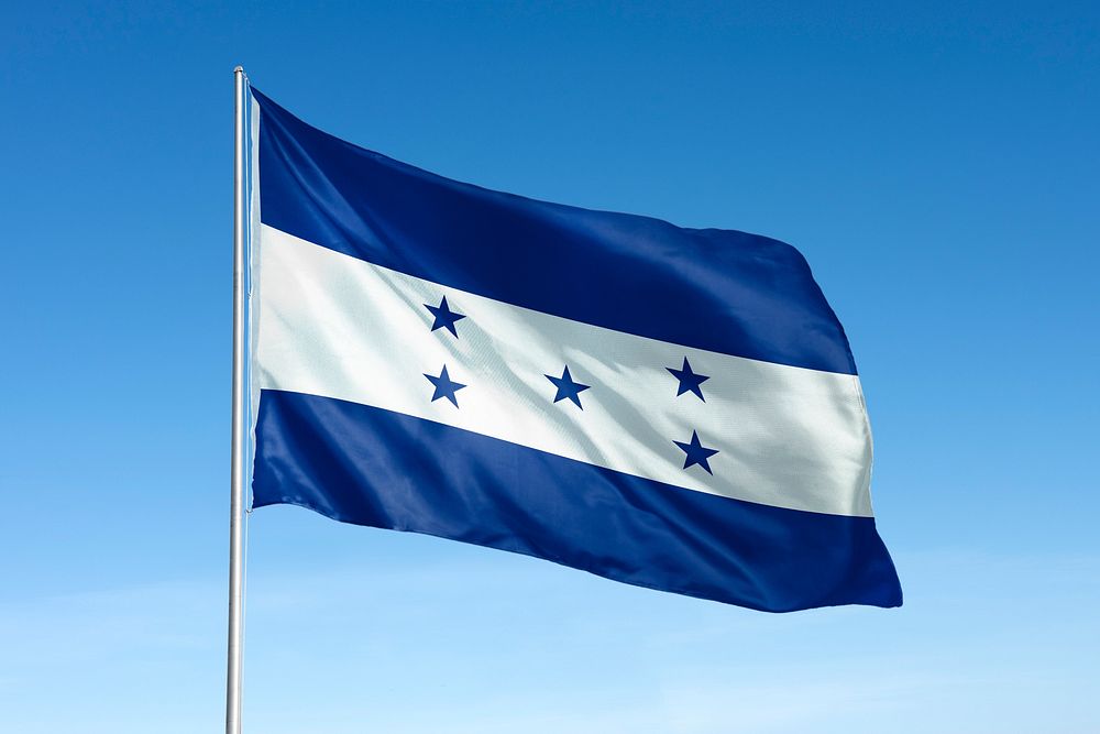 Waving Honduras flag, national symbol, blue sky