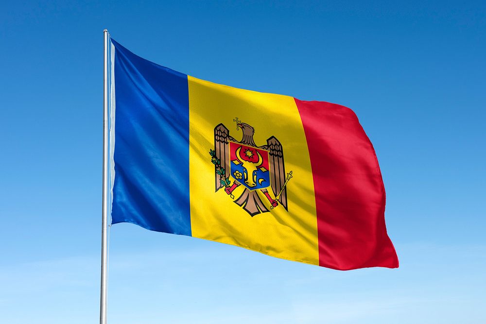 Waving Moldova flag, national symbol, blue sky