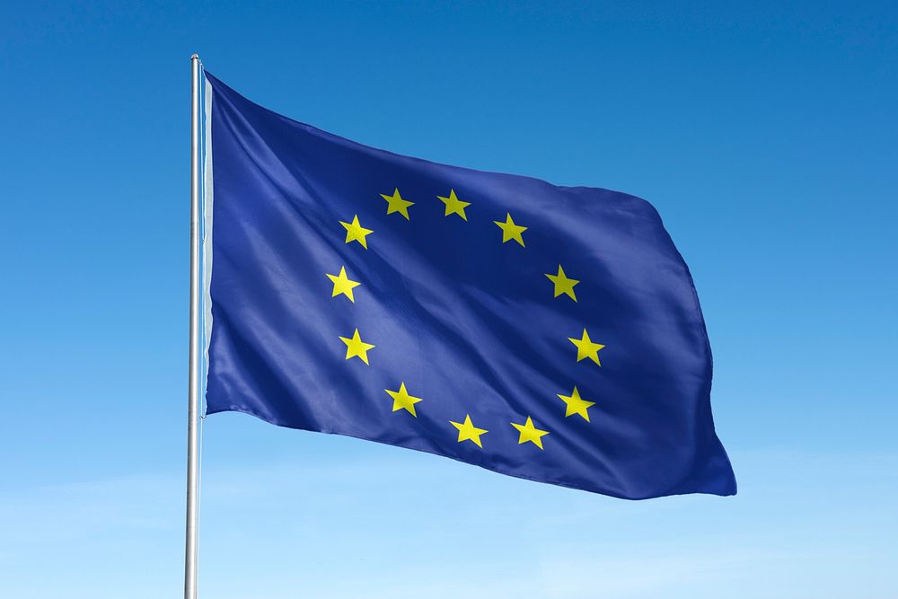 Waving European union flag, national symbol, blue sky