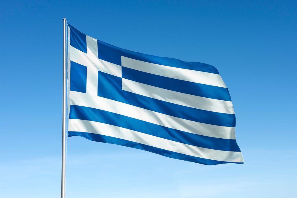 Waving Greece flag, national symbol, blue sky