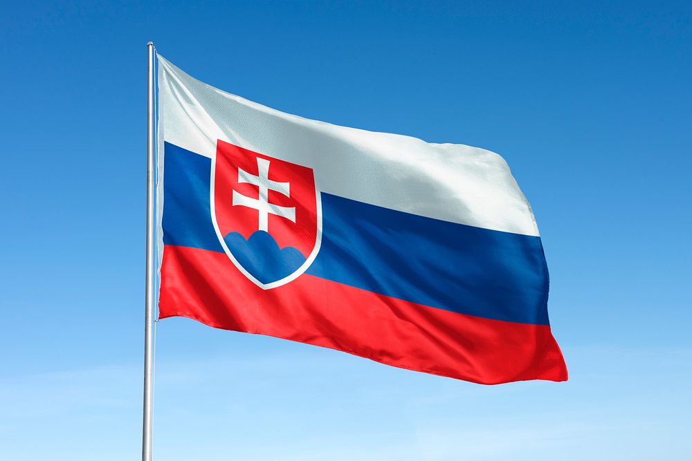 Waving Slovakia flag, national symbol, blue sky