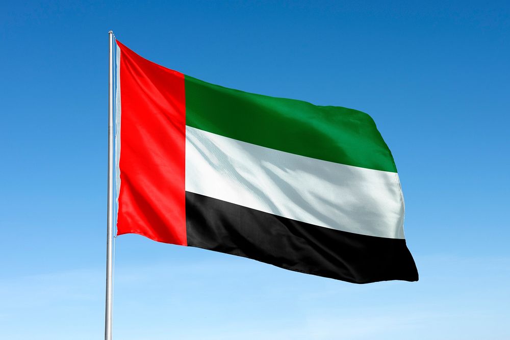 Waving United Arab Emirates, UAE flag, national symbol, blue sky