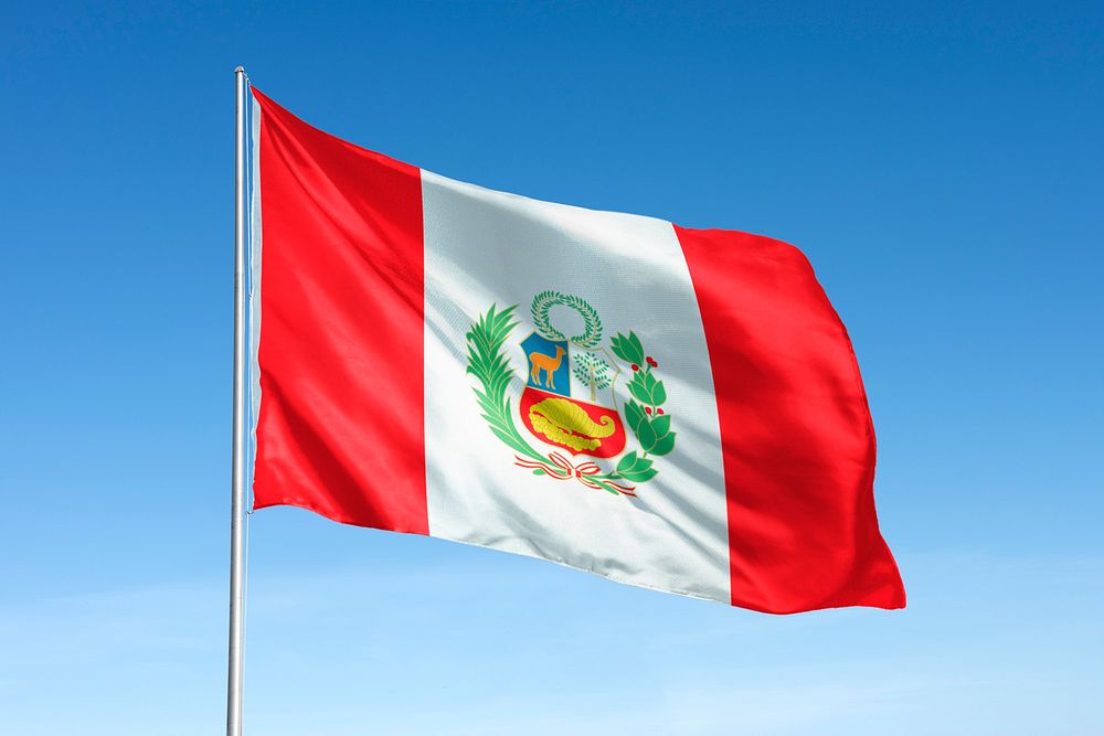 Waving Peru flag, national symbol, blue sky