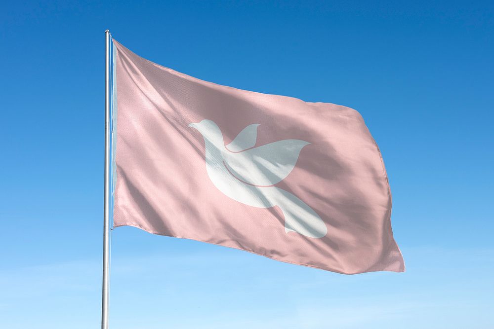 Waving Dove flag, peace symbol, blue sky