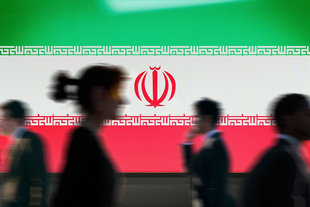 Iran flag led screen, silhouette people