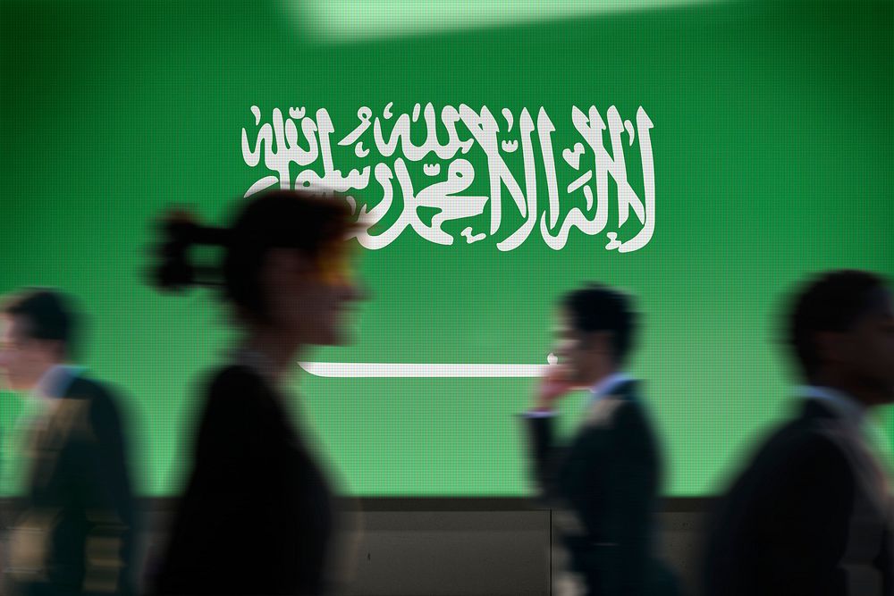 Saudi Arabia flag led screen, silhouette people