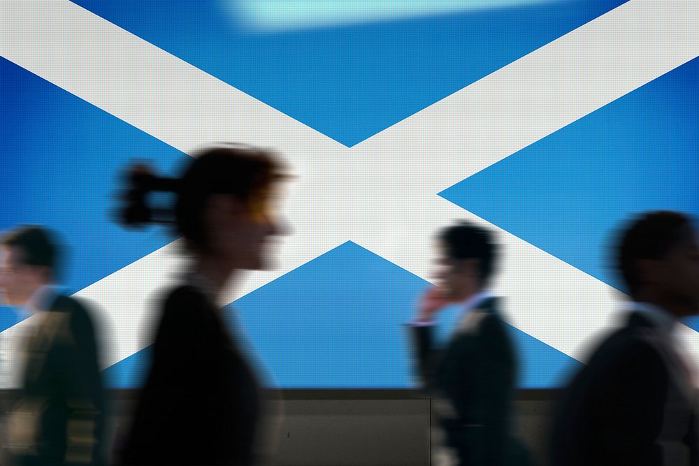 Scotland flag led screen, silhouette people