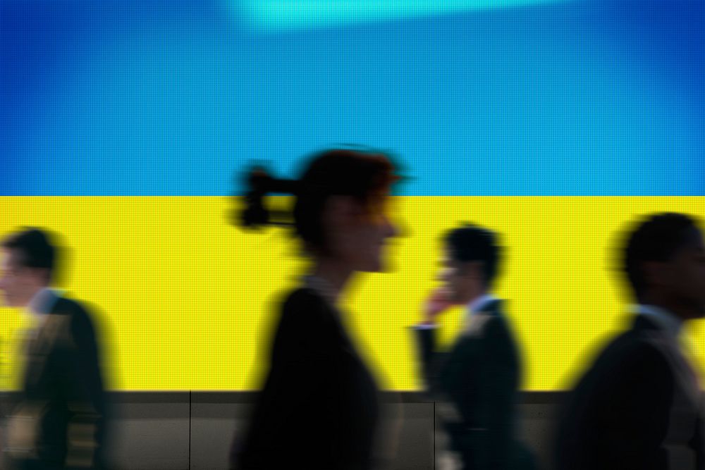 Ukraine flag led screen, silhouette people