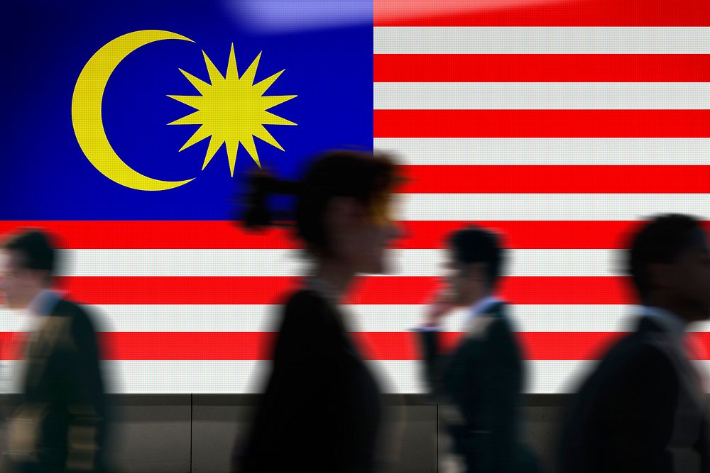 Malaysia flag led screen, silhouette people
