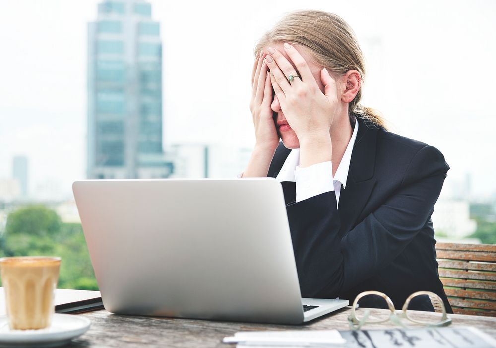 Stressed woman working on her laptop