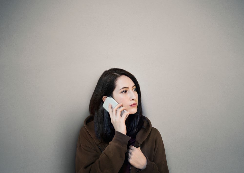 Woman using mobile phone calling telecommunication