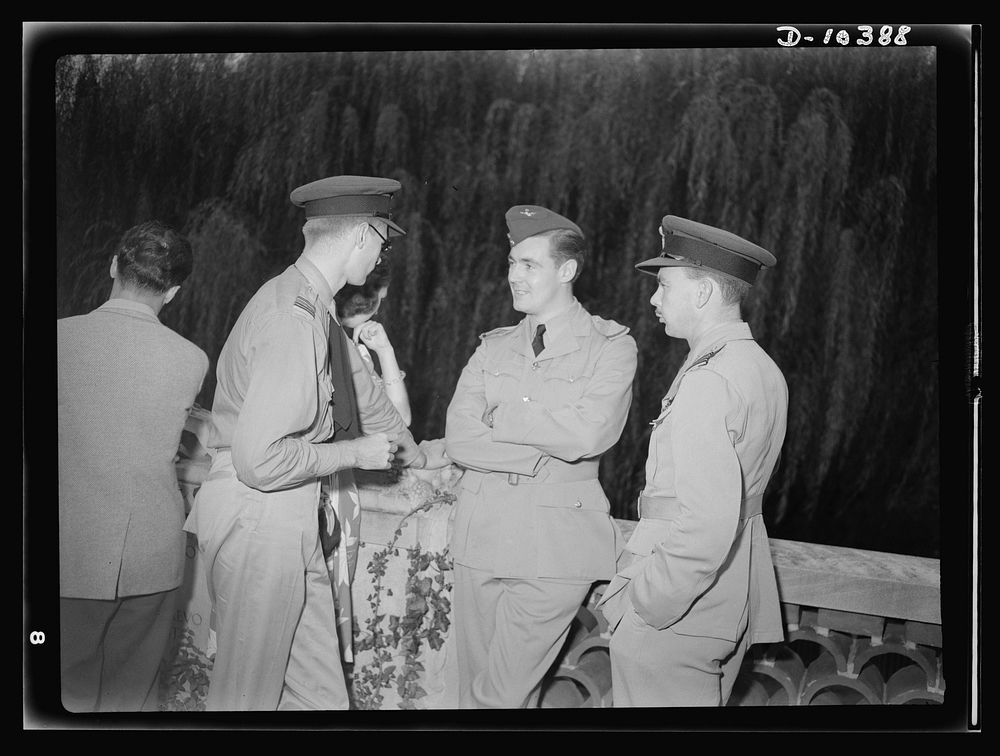 The uniforms are different, but the cause is the same. Officers of the United Nations attend a garden party of the United…