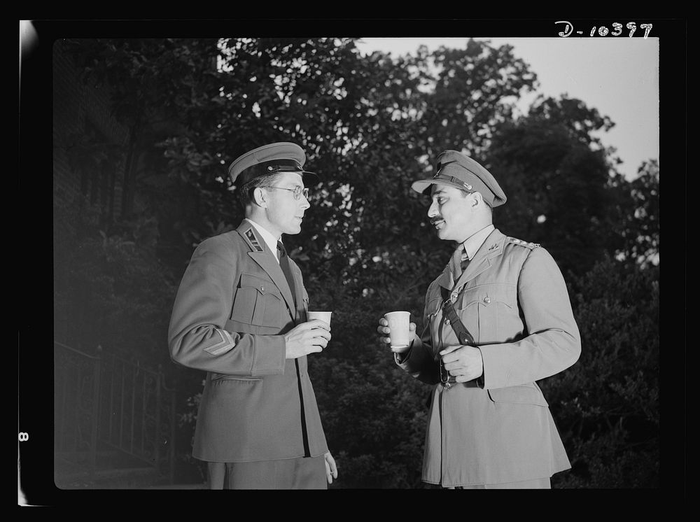 The uniforms are different but the cause is the same. Officers of the United Nations attend a garden party of the United…