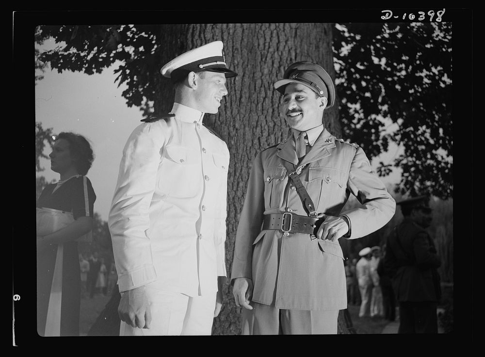 The uniforms are different but the cause is the same. Officers of the United Nations attend a garden party of the United…
