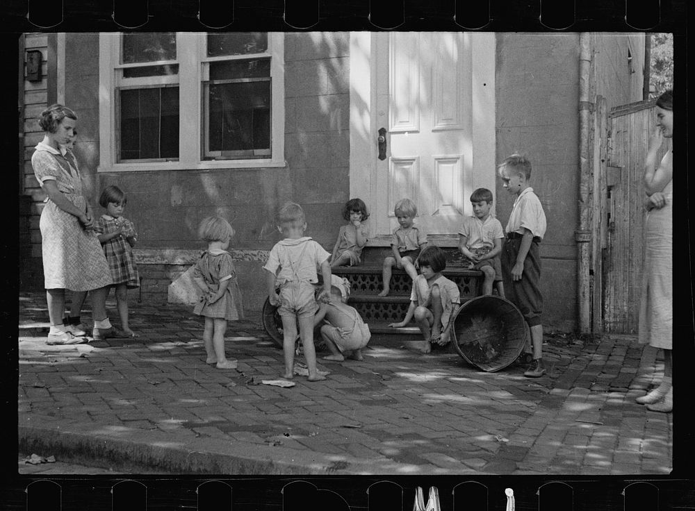 [Untitled photo, possibly related to: Poor children playing on sidewalk, Georgetown, Washington, D.C.]. Sourced from the…