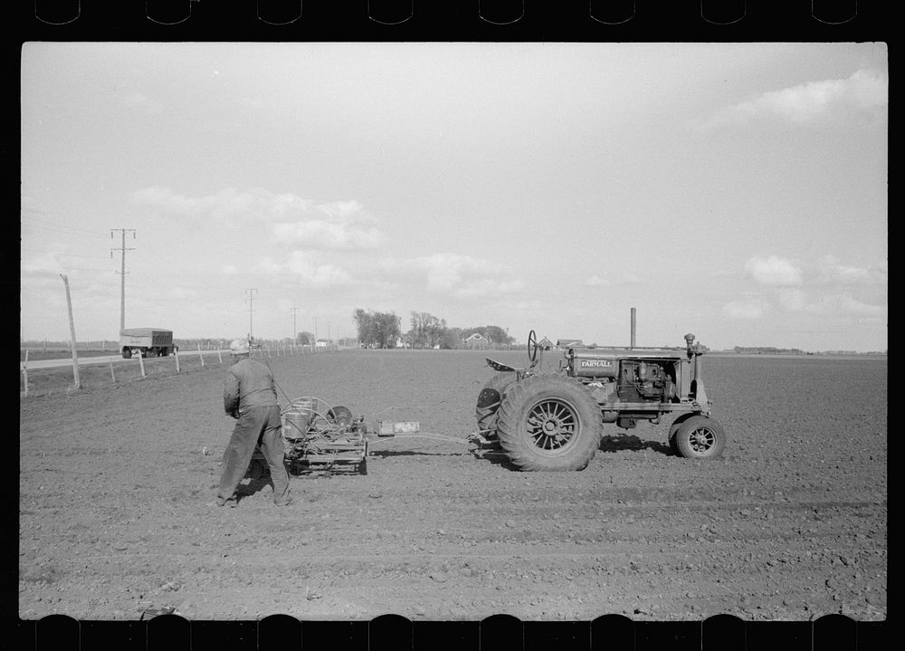 Four-row tractor corn planter, Jasper County, Iowa. Sourced from the Library of Congress.