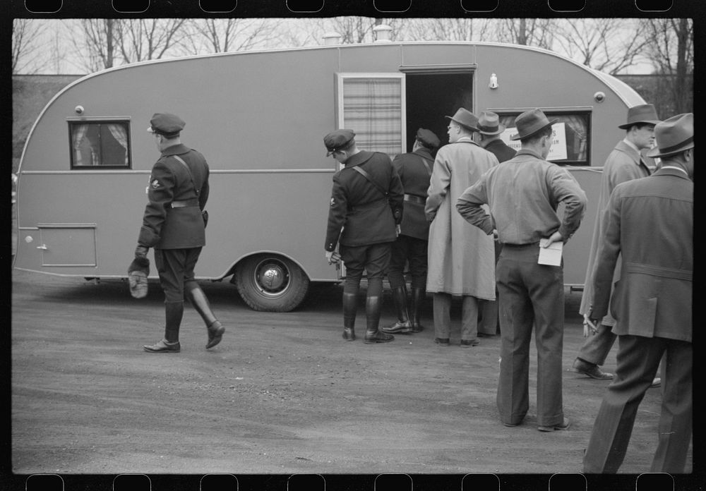 Washington, D.C. A demonstration of FSA (Farm Security Administration) trailers. Bystanders and police escort inspecting a…