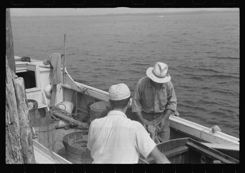 [Untitled photo, possibly related to: Eastern shoreman checking motor before leaving for home. Rock Point, Maryland].…