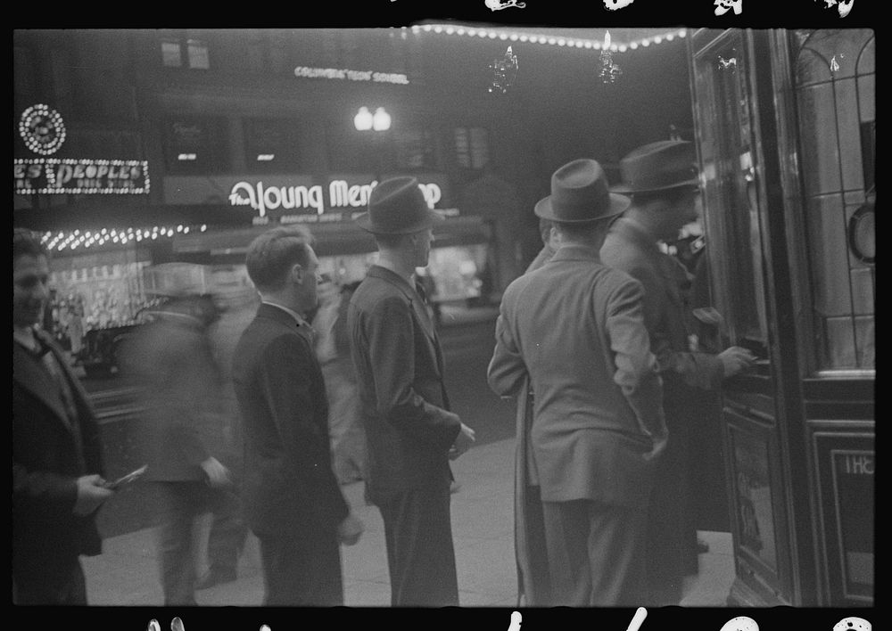 [Untitled photo, possibly related to: Washington, D.C. A street scene showing people waiting in line for tickets outside…