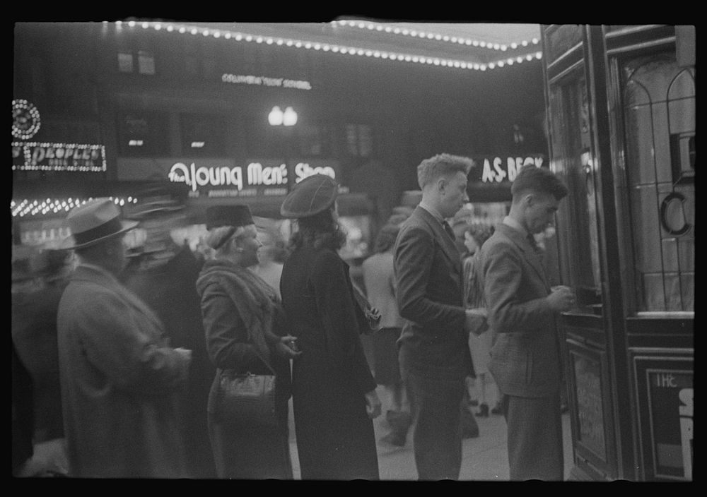 [Untitled photo, possibly related to: Washington, D.C. A street scene showing people waiting in line for tickets outside…