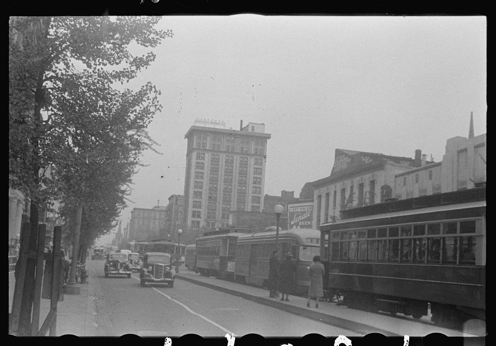 Washington, D.C. A street scene, probably 14th Street, showing automobile and street car traffic. The People's Life…