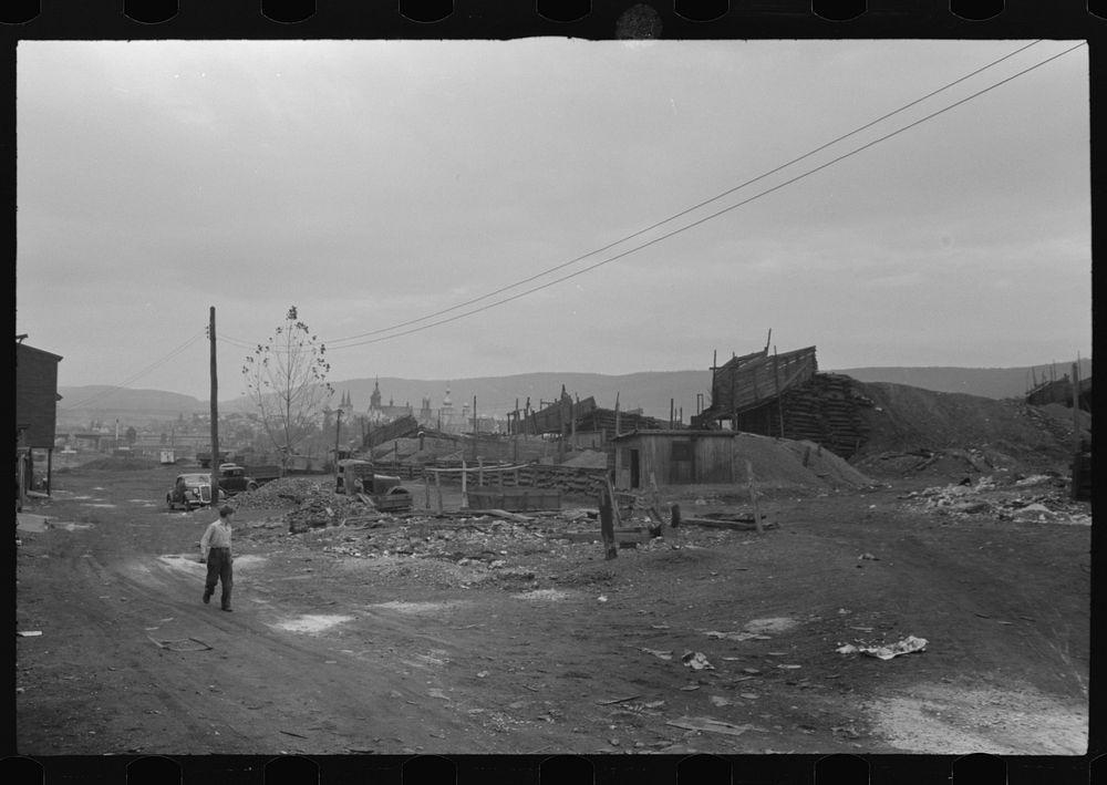 [Mount Carmel,] Pennsylvania. Church spires and houses seen over coalyards on the outskirts of town. Sourced from the…