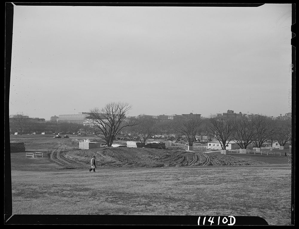 Washington, D.C. Construction of temporary war emergency buildings on the Mall, near 16th and 17th Streets, N.W. A building…
