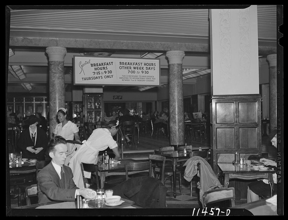 Washington, D.C. Sign in the S & W cafeteria informing patrons of the change in hours caused by the shortage of help and…