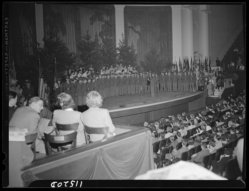 Washington, D.C. Soldiers from a nearby army camp singing at the National Folk Festival at Constitution Hall. Sourced from…
