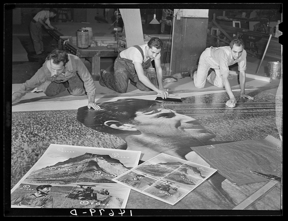 [Untitled photo, possibly related to: Workers working on installation of war bond mural. Grand Central Station, New York…