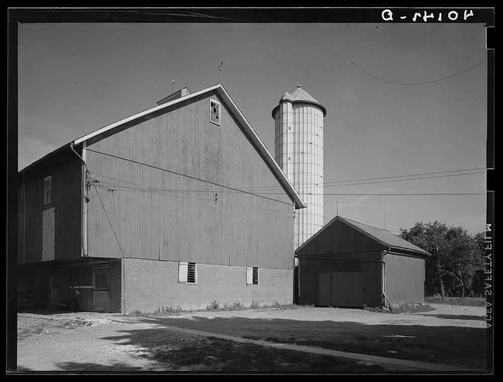 Lititz (vicinity), Lancaster County, Pennsylvania. Barn and silo on the farm of C.F. Minnich. Sourced from the Library of…