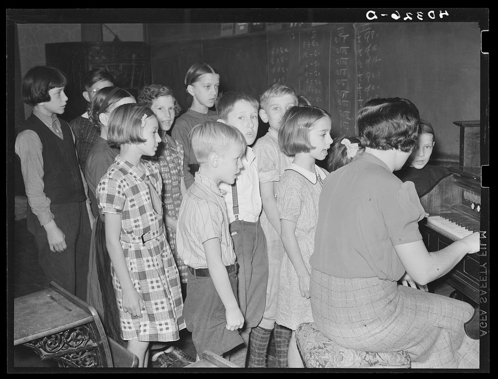 Lancaster County, Pennsylvania. The children in Martha Royer's school singing the "Star Spangled Banner." Notice the Amish…