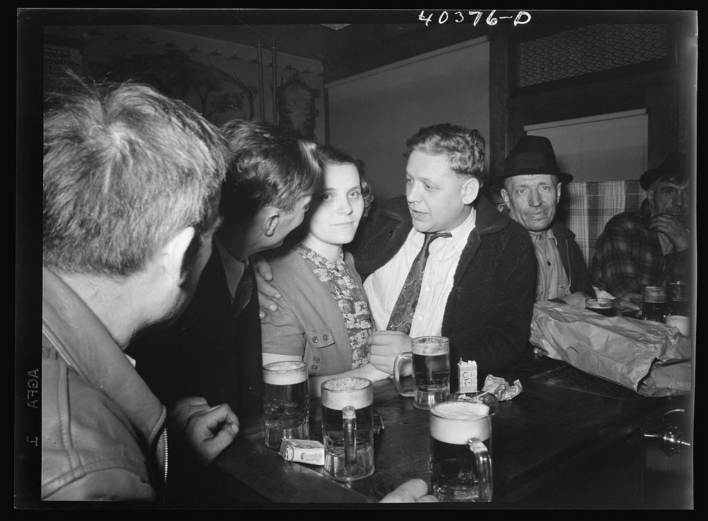 Shenandoah, Pennsylvania. Some men and a woman at Filipek's bar. Sourced from the Library of Congress.