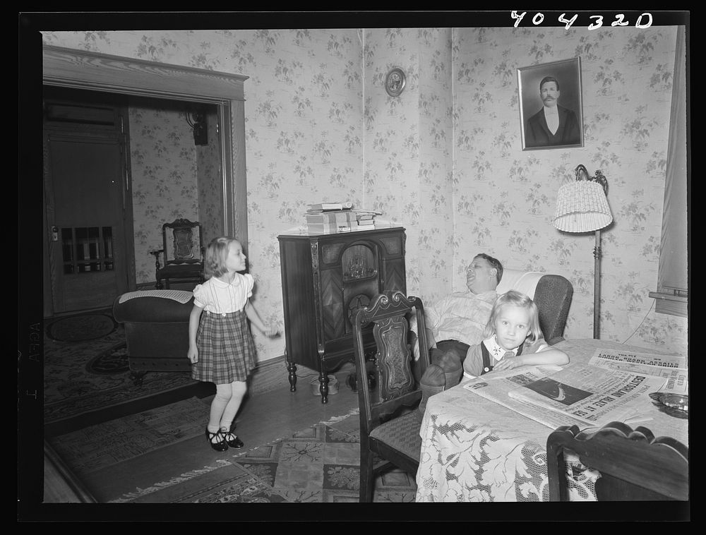 Shenandoah, Pennsylvania. Joe Gladski and two small daughters in the dining room at their home. He is a miner at Maple Hill.…