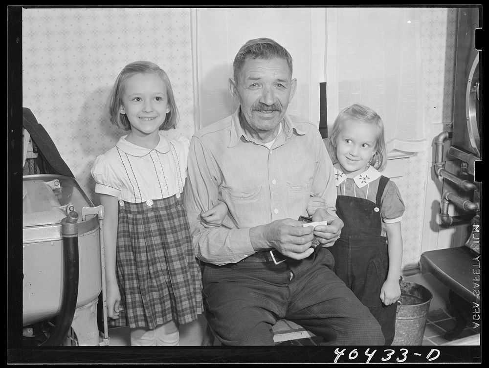 Shenandoah, Pennsylvania. Joe Gladski's father and two small daughters. An electric washing machine appears in the left-hand…