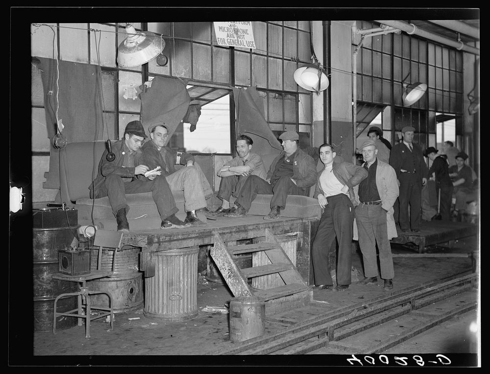 Strikers guarding window entrance to Fisher body plant number three. Flint, Michigan. Sourced from the Library of Congress.