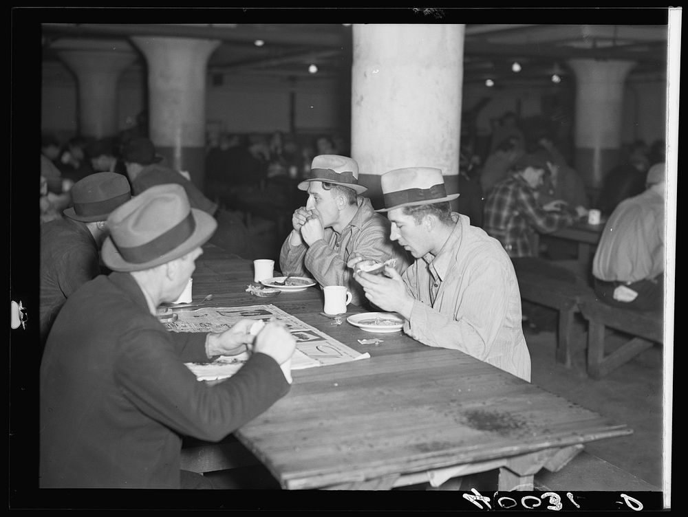 Strikers eating in cafeteria in Fisher body plant factory number three. Flint, Michigan. Sourced from the Library of…