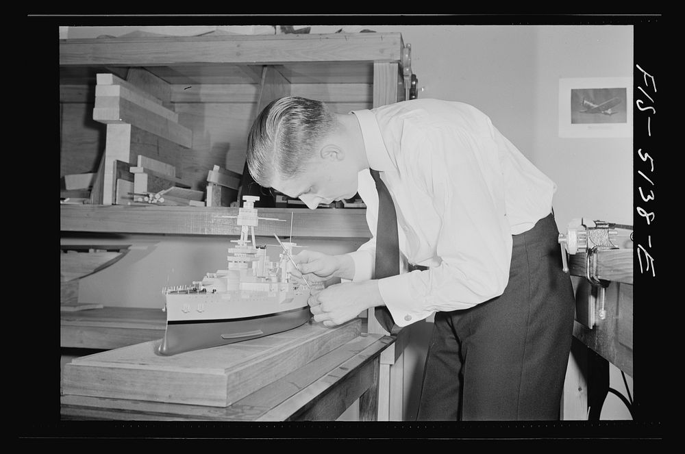 U.S. Naval Academy, Annapolis, Maryland. Midshipman studying a ship's model. Sourced from the Library of Congress.