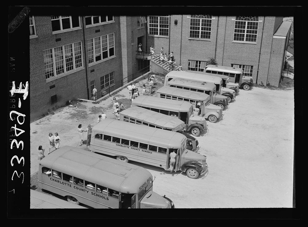 [Untitled photo, possibly related to: Keysville, Virginia. Randolph Henry High School. Buses bring students from miles…