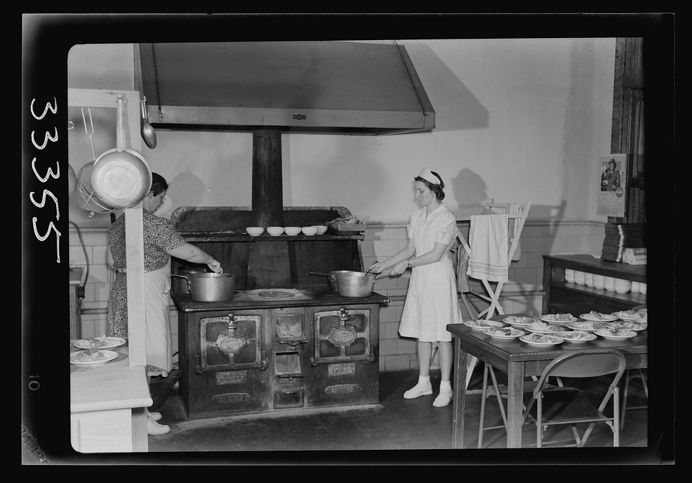 Keysville, Virginia. Randolph Henry High School. Kitchen of cafeteria. Lunches cost about fifteen cents. Students don't have…