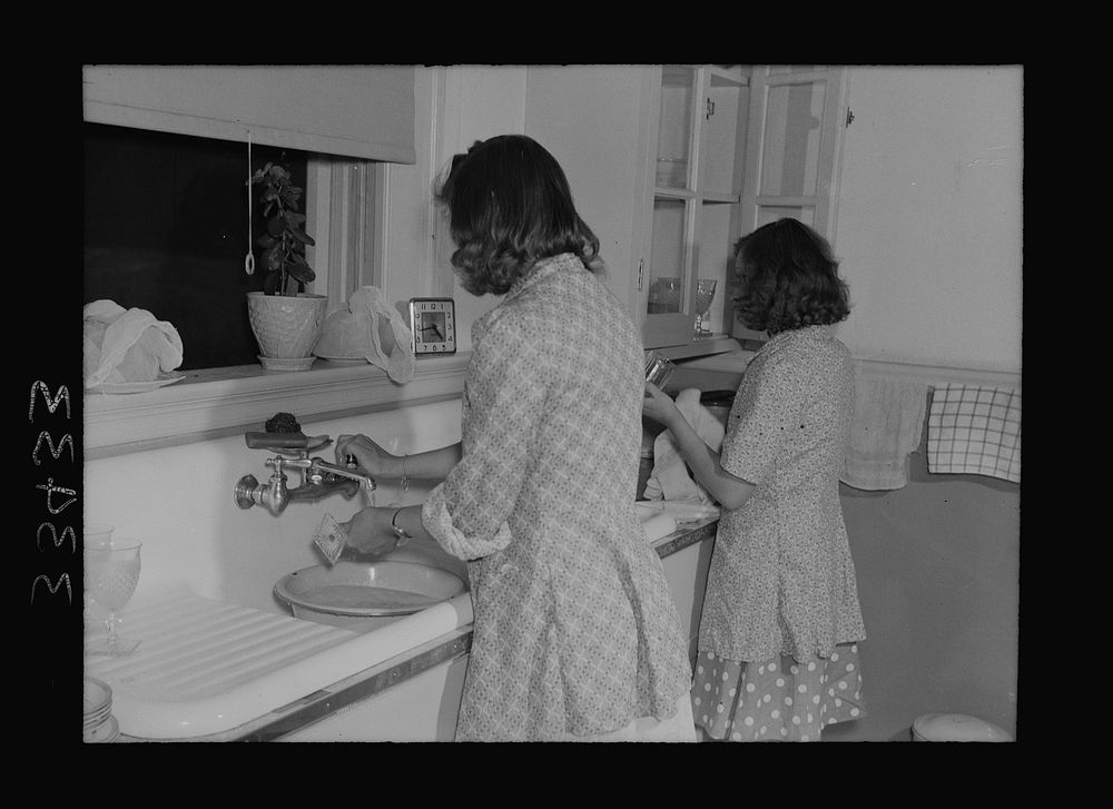 Keysville, Virginia. Randolph Henry High School. Washing dishes after a meal in the home economics cottage. Sourced from the…