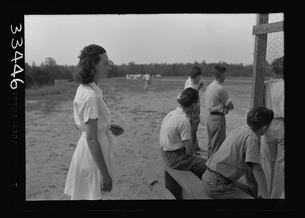 Keysville, Virginia. Randolph Henry High School. Playing baseball during gym period. Girl replaced man teacher who was…